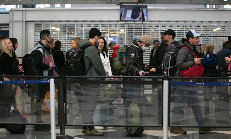 Passengers wait for the resumption of flights at O