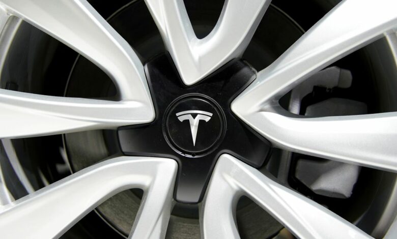 Tesla logo is seen on a wheel rim during the media day for the Shanghai auto show in Shanghai