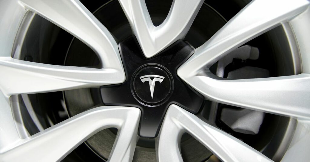 Tesla logo is seen on a wheel rim during the media day for the Shanghai auto show in Shanghai