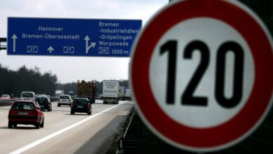 Cars pass a 120 km/h (75 mph) speed limit sign on the A27 Autobahn near the northern German city of Bremen