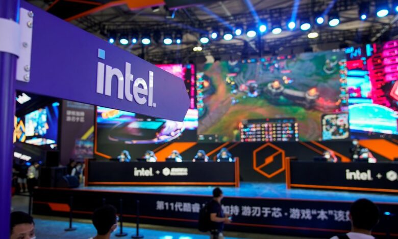 Visitors are seen at the Intel booth during the China Digital Entertainment Expo and Conference, also known as ChinaJoy, in Shanghai