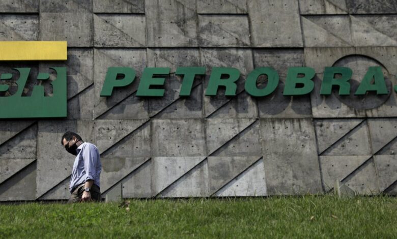 A man walks past the headquarters of Brazilian oil company Petrobras in Rio de Janeiro
