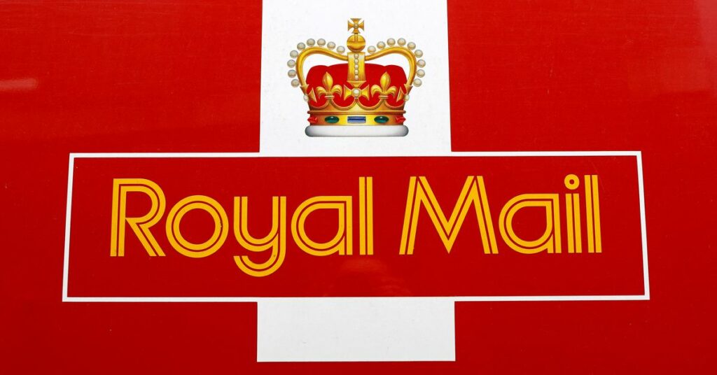 A Royal Mail sign is pictured on a delivery van outside a Post Office, in St Albans