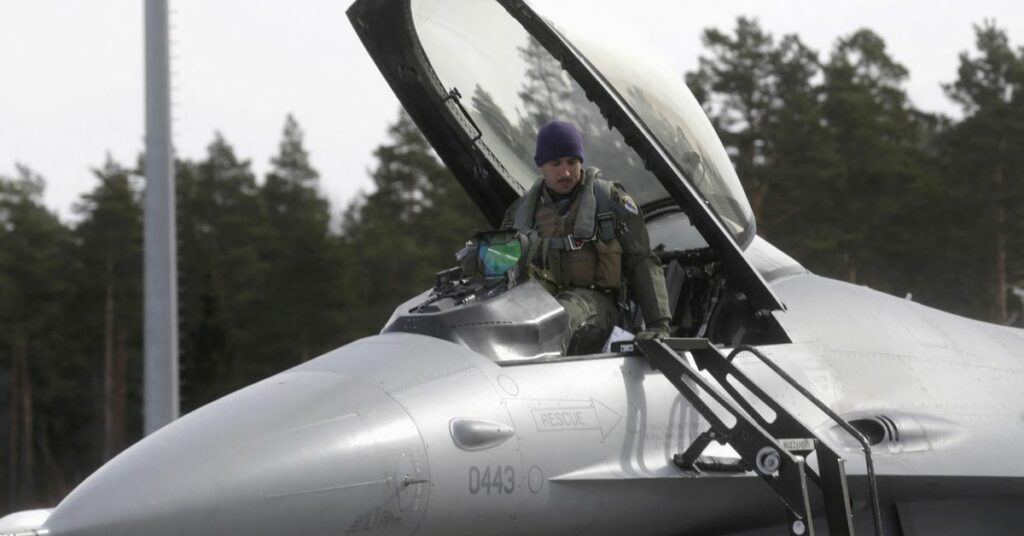 U.S. Air Force 510th Fighter Squadron pilot leaves his F-16 fighter in Amari air base