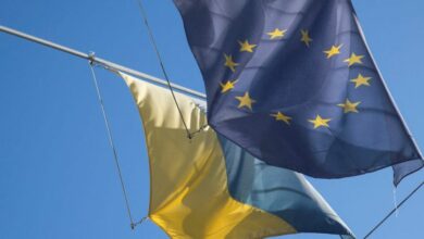 Flag of EU flies next to Ukraine