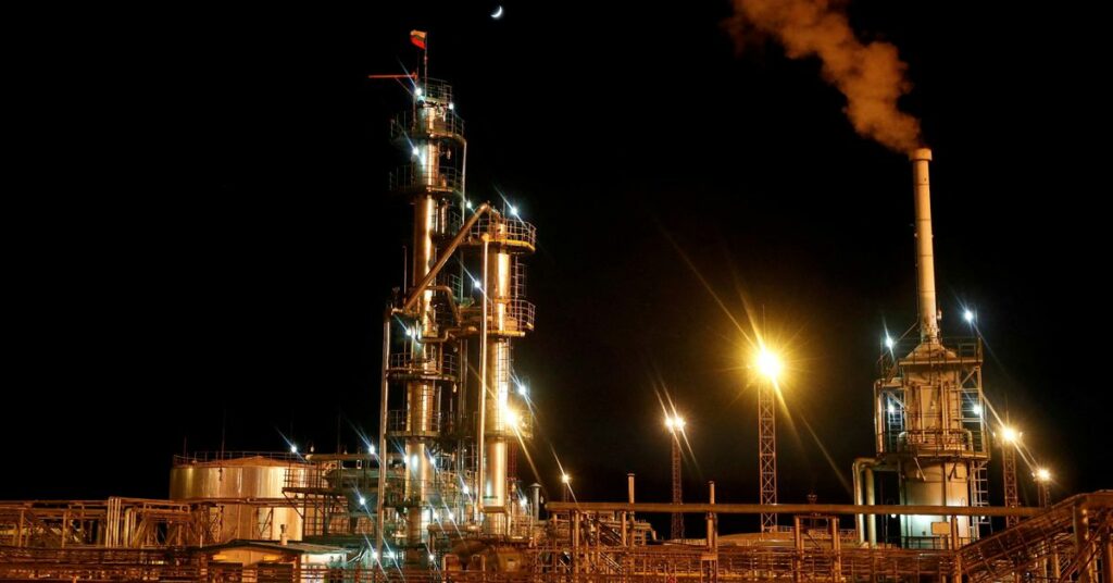 A Russian state flag flies on the top of a diesel plant in the Irkutsk Oil Company-owned Yarakta Oil Field in Irkutsk Region