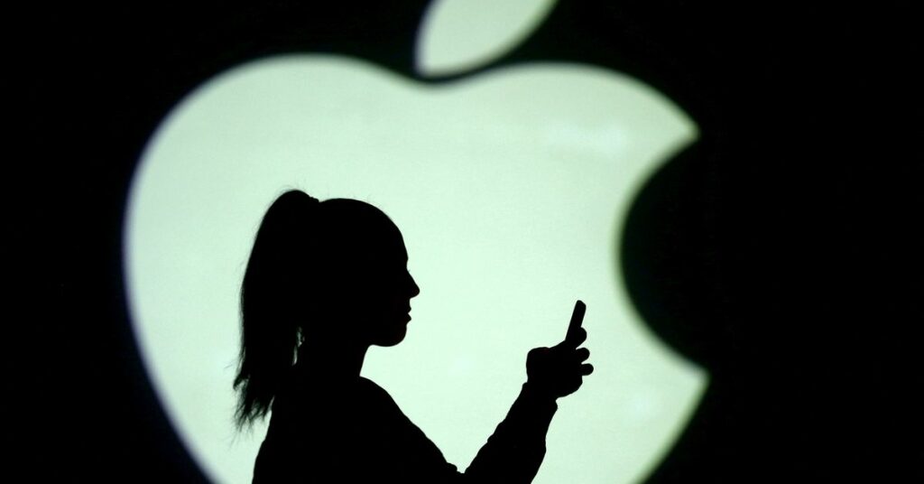 Picture illustration of a silhouette of a mobile user next to a screen projection of the Apple logo