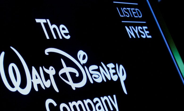 A screen shows the trading info for The Walt Disney Company company on the floor of the NYSE in New York
