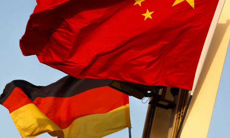 German and Chinese national flags fly in Tiananmen Square ahead of the visit of German Chancellor Angela Merkel in Beijing
