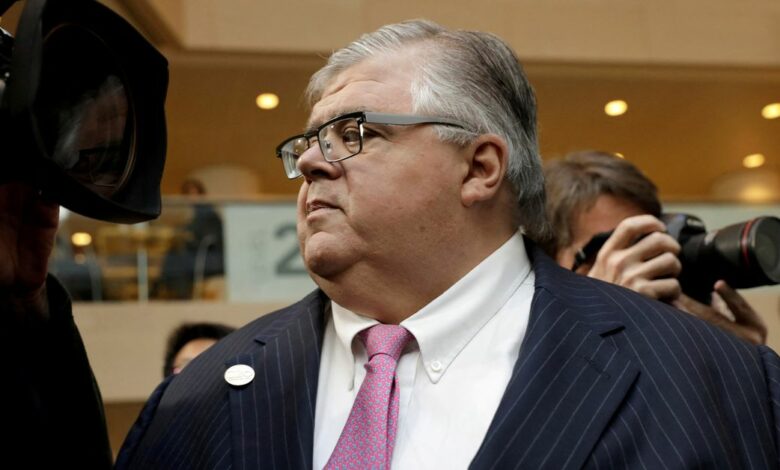 BIS General Manager Agustin Carstens leaves after G-20 finance ministers and central banks governors family photo during the IMF/World Bank spring meeting in Washington