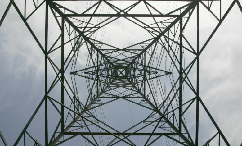 An electricity pylon is pictured near Cobham in Surrey, southern England