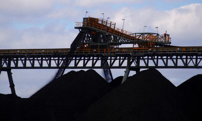 Coal is unloaded onto large piles at the Ulan Coal mines near the central New South Wales town of Mudgee, Australia