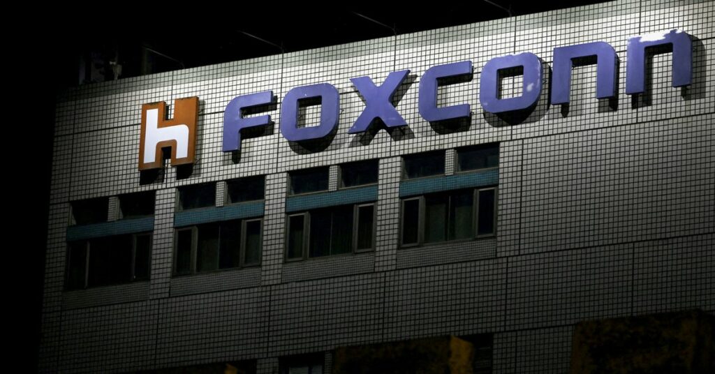 FILE PHOTO: The logo of Foxconn is seen outside a company
