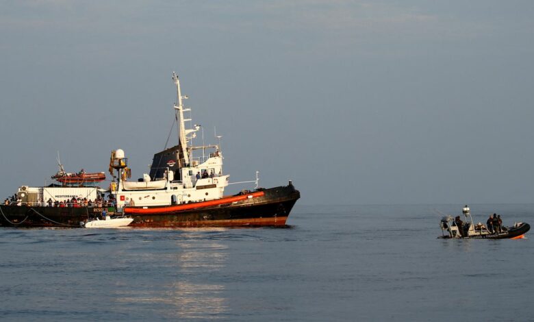 A RHIB of the Italian Finance Police patrols near the Mare Jonio, operated by Italian charity Mediterranea Saving Humans, and the German NGO Sea-Eye migrant rescue ship
