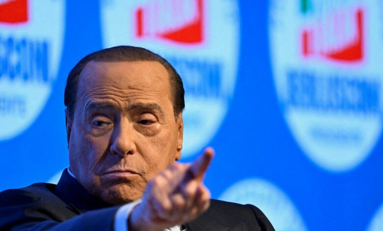 Former Italian prime minister Silvio Berlusconi gestures during a campaign rally