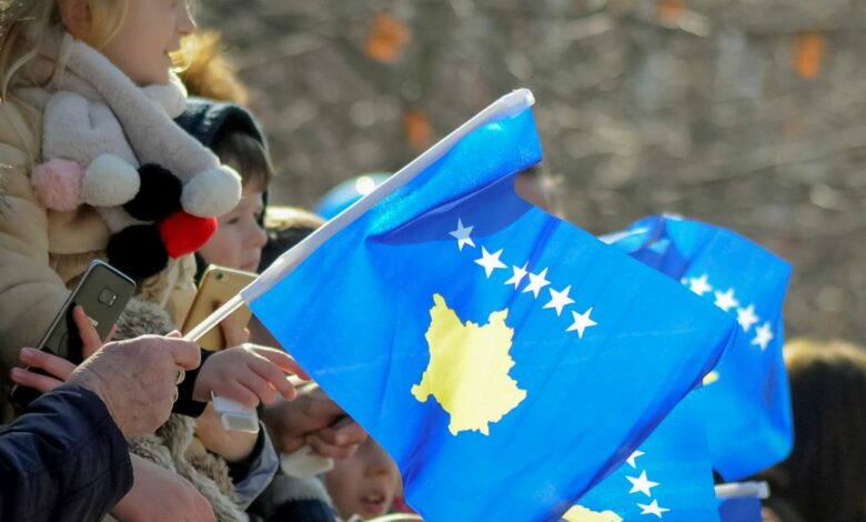 People attend celebrations of the 11th anniversary of Kosovo independence in Pristina