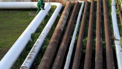 Employee walks on top of pipelines at Hungarian oil and gas group MOL
