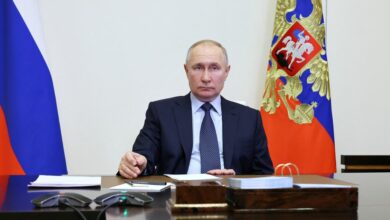 Russian President Vladimir Putin chairs a meeting at the Novo-Ogaryovo residence outside Moscow