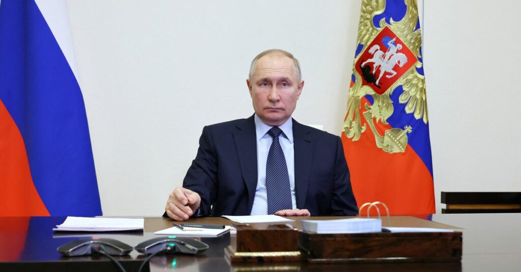 Russian President Vladimir Putin chairs a meeting at the Novo-Ogaryovo residence outside Moscow