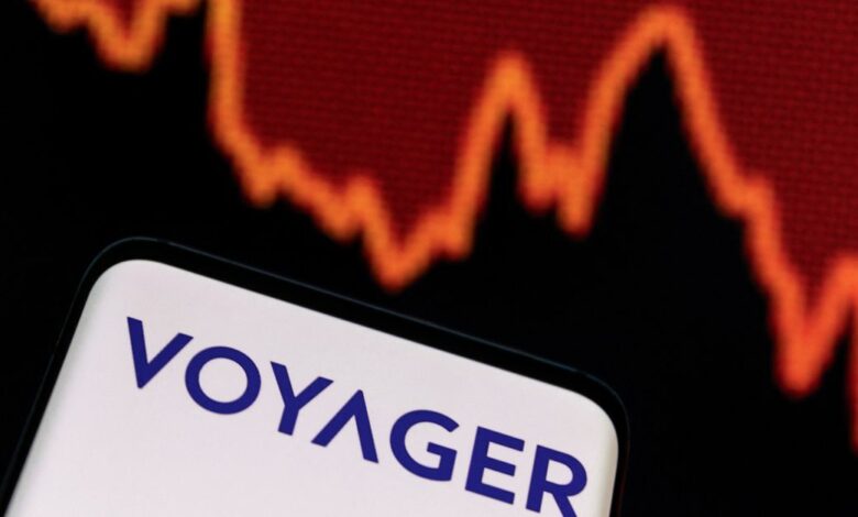 Illustration shows Voyager Digital logo and decreasing stock graph