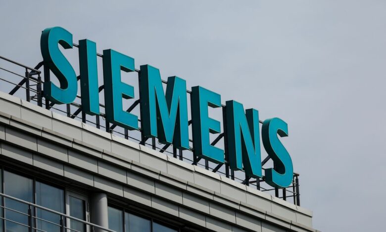 A sign with the logo of Siemens company is on display outside its office in Moscow