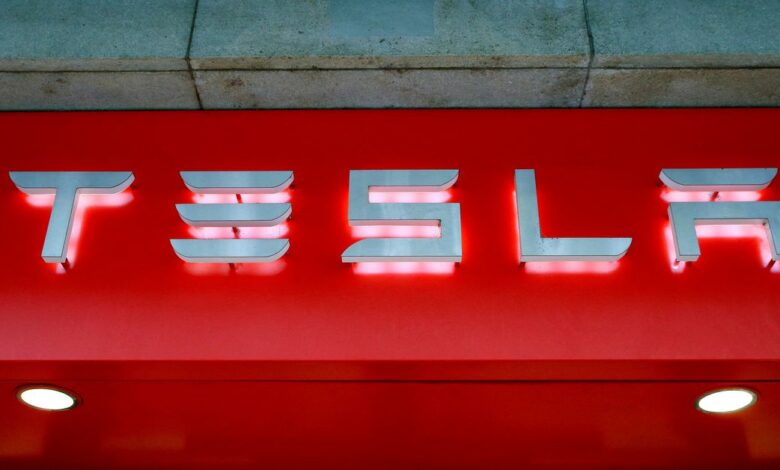 The logo of U.S. car manufacturer Tesla is seen in Zurich