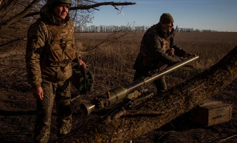 Ukrainian servicemen prepare an anti-tank grenade launcher to shoot  at a frontline in Donetsk Region