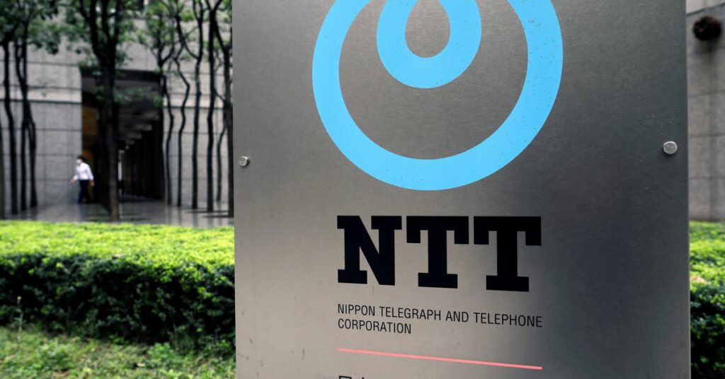The logo of NTT (Nippon Telegraph and Telephone Corporation) is displayed at the company office in Tokyo