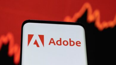 Illustration shows Adobe logo and stock graph