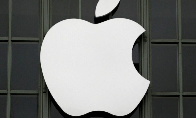 The Apple Inc logo is shown outside the company