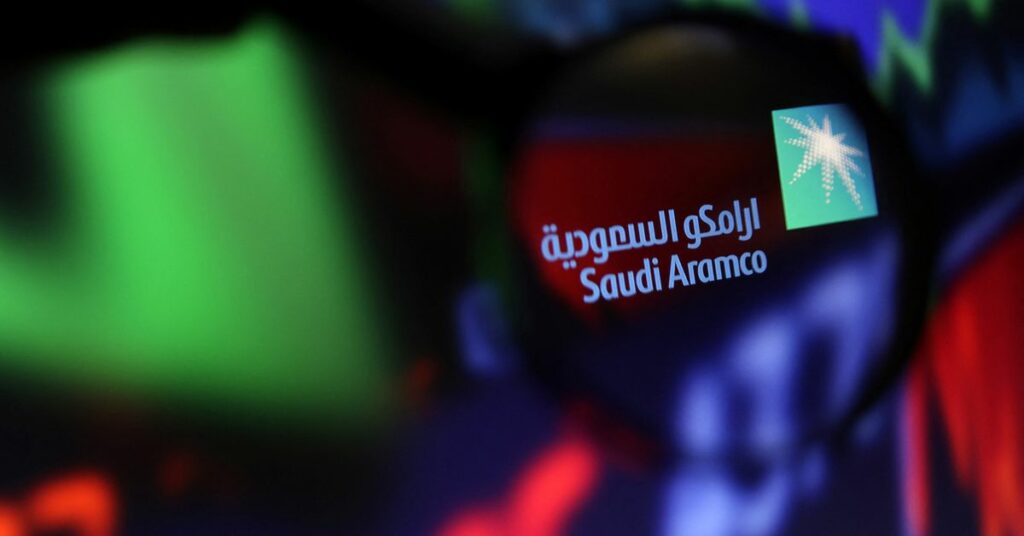 Illustration shows Saudi Aramco logo and stock graph