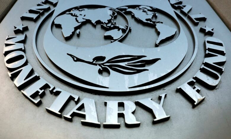 The IMF logo is seen outside the headquarters building in Washington