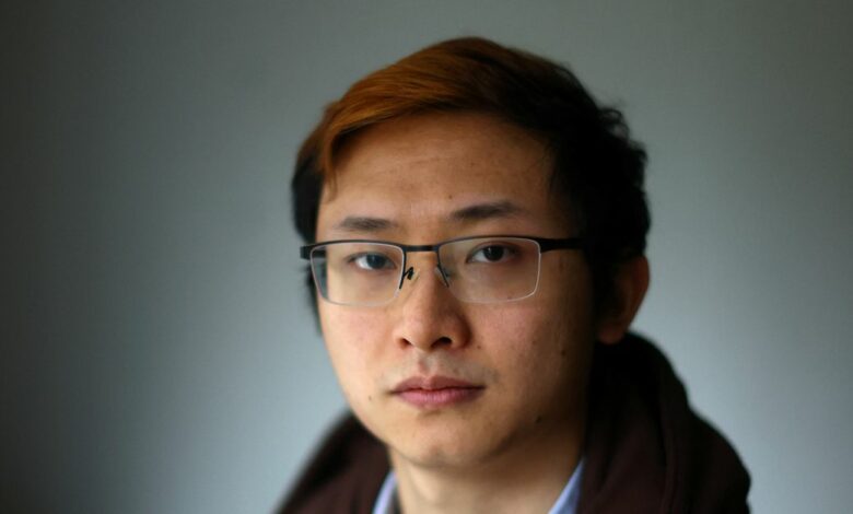 Junior Doctor Poh Wang poses for a photograph at his home in London