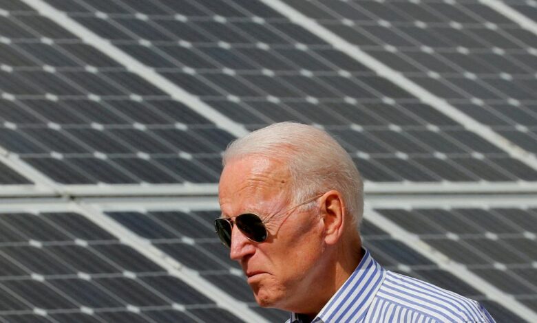 Biden walks past solar panels in Plymouth