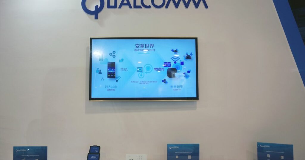 Booth of U.S. chipmaker Qualcomm is pictured at an expo in Beijing