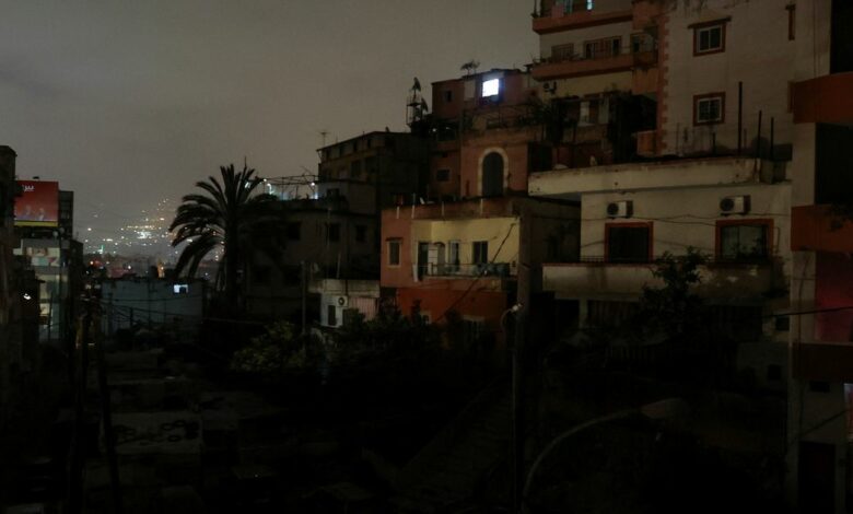 Residential buildings are pictured at night during a power cut in Beirut