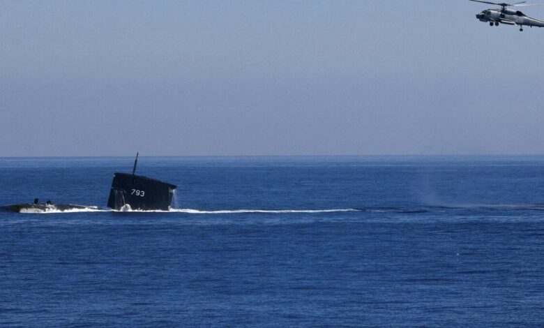 A S70C helicopter can be seen flying around SS793 Submarine as part of Taiwan