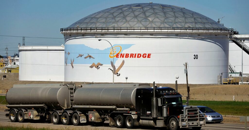 A storage tank looms over a freeway at the Enbridge Edmonton terminal in Edmonton