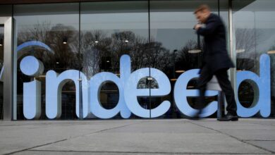 A man walks past the offices of Indeed in the centre of Dublin, Ireland