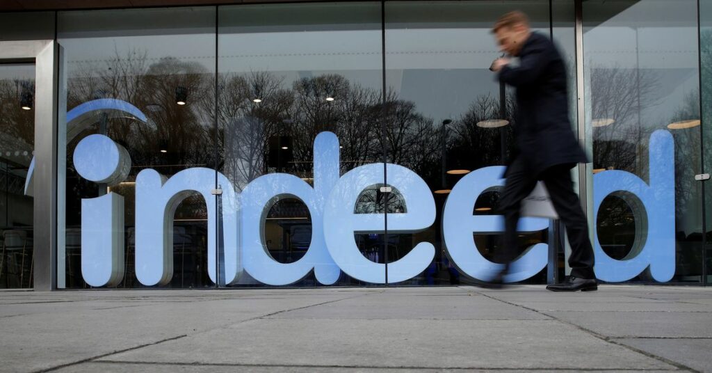 A man walks past the offices of Indeed in the centre of Dublin, Ireland