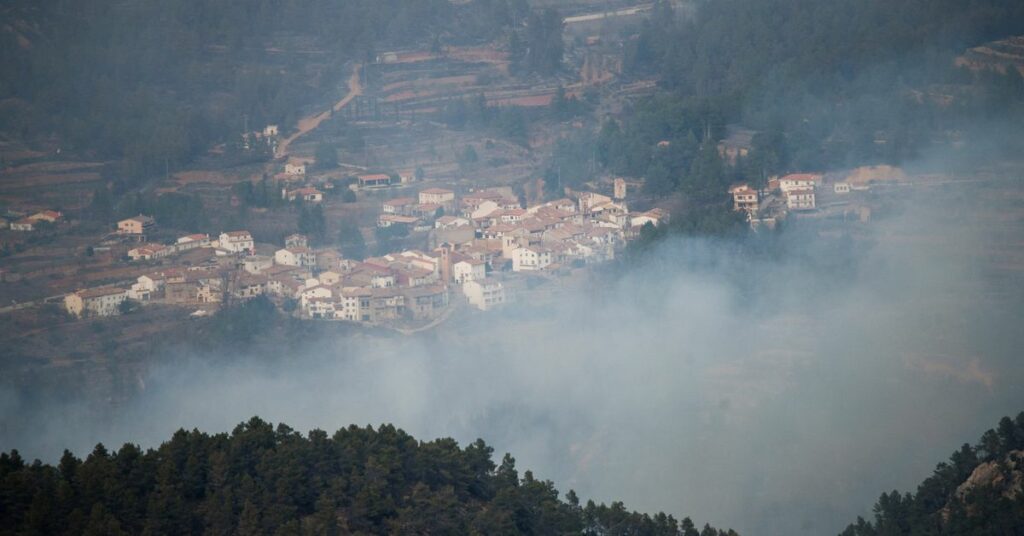 Smoke rises during a wildfire in Los Calpes