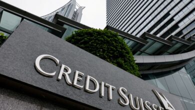 The logo of Credit Suisse is seen outside its office building in Hong Kong
