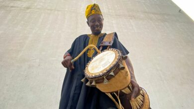 Nigerian drummer Adebayo Ayodeji performs during a drumming workshop for children in Lagos