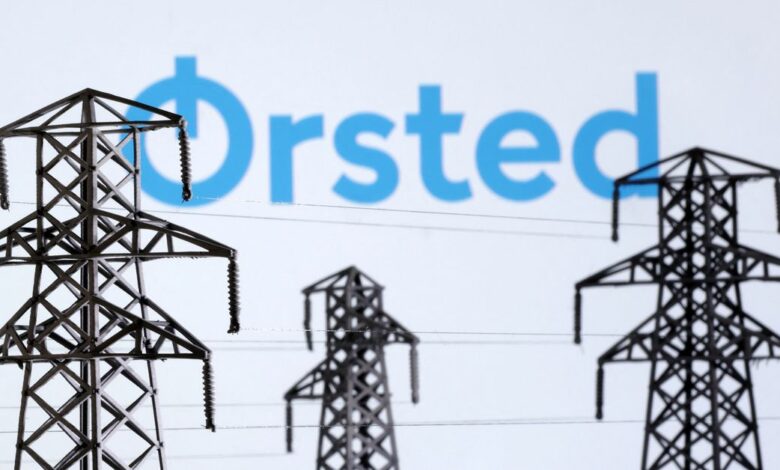 Illustration shows Electric power transmission pylon miniatures and Orsted logo