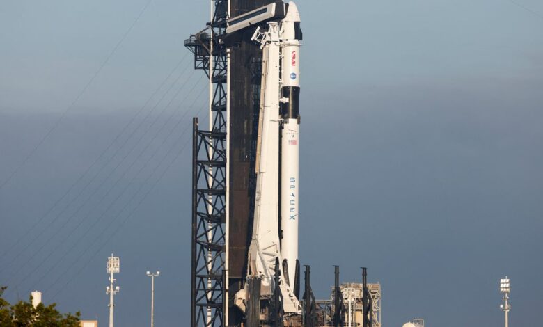A Falcon 9 rocket is readied for flight after a delay for NASA
