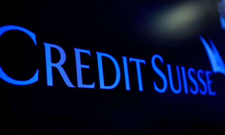 The Credit Suisse logo is displayed on a screen on the floor of the NYSE in New York