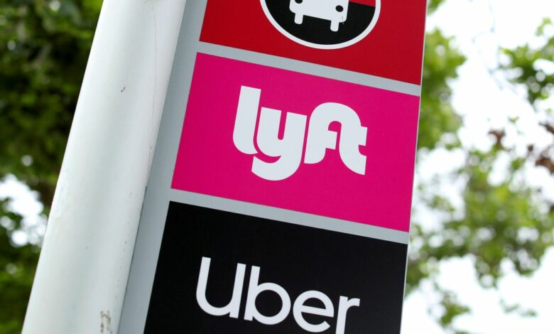 The logos of Lyft and Uber are displayed in San Diego