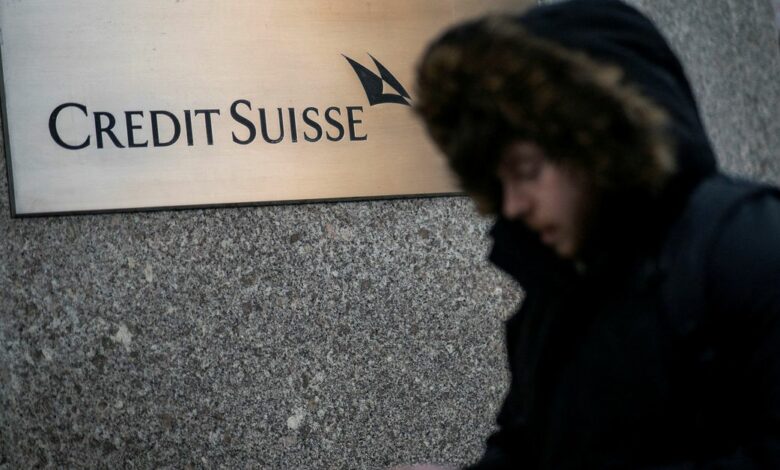 A man walks near the Credit Suisse bank headquarters in New York