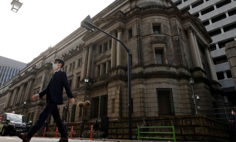 A man walks in front of the headquarters of Bank of Japan in Tokyo
