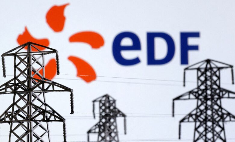Illustration shows Electric power transmission pylon miniatures and EDF (Electricite de France) logo